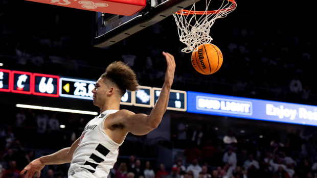 Cincinnati Bearcats guard Dan Skillings Jr. (0) dunks in the second half of the NCAA basketball game between Cincinnati Bearcats and UCF Knights at Fifth Third Arena in Cincinnati on Saturday, Jan. 27, 2024.